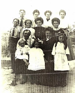 Christopher Columbus Williams Family, 1909 Top Row: Alva Williams, Louie Williams Stipp, Pearl Williams Sullens, Nettie Williams George (Pearl and Nettie are twins) Third Row: Forrest Williams, "Lena" Charlene Williams Swift, Gail Williams Warren, Lottie Williams Cole Second Row: Christopher Columbus Williams and Mary Taylor Williams, Loren Williams on Columbus lap, "Eva Williams Black," Yada Williams Sullens (yes, Pearl and Yada married brothers)