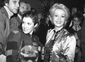 Debbie Reynolds and Carrie Fisher smile at well wishers in New York